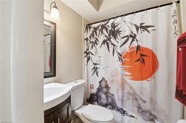 Bathroom with vanity and a shower with shower curtain