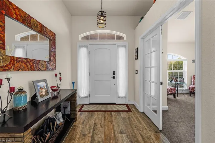 Entryway with dark wood-style flooring