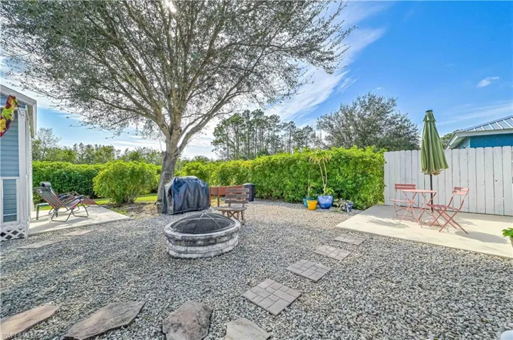 View of patio / terrace with a fire pit and grilling area