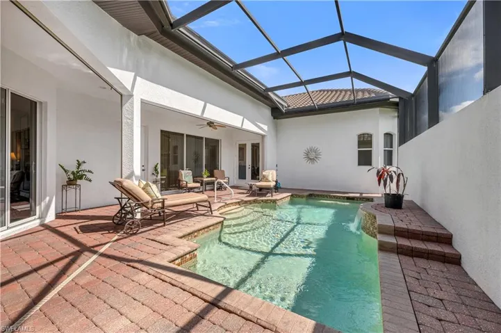Pool featuring french doors, a patio area, ceiling fan, and a lanai