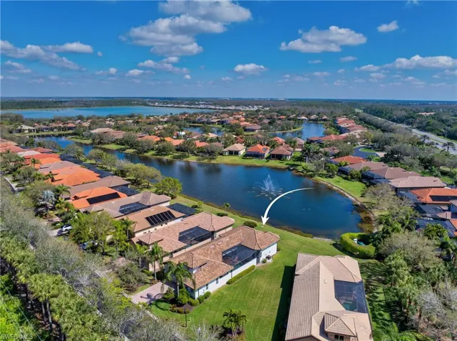Birds eye view of property featuring a residential view and a water view