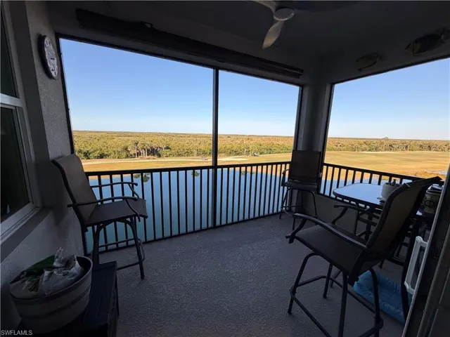 Balcony featuring a ceiling fan