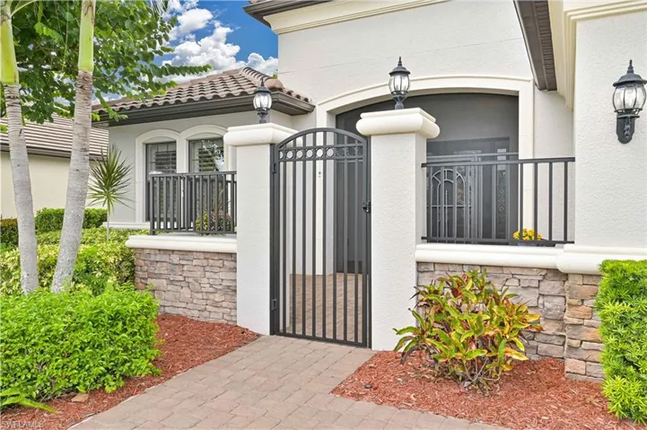 Gate featuring a fenced front yard