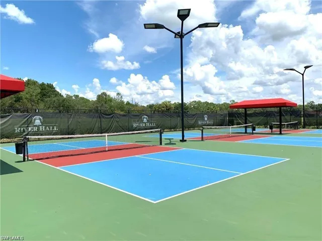 View of tennis court with community basketball court