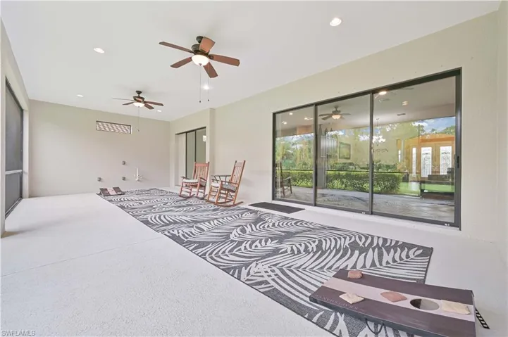 Bedroom with access to outside, recessed lighting, a closet, and a ceiling fan