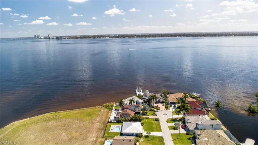 Aerial perspective of suburban area with a large body of water