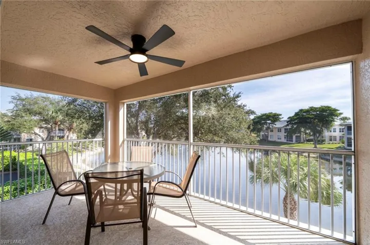 Lanai with lake view and water feature.
