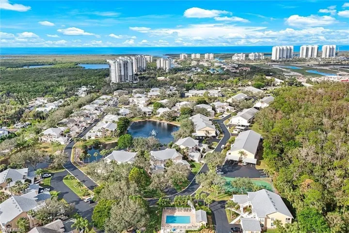 View of community facing West. Pristine beaches close by. Wiggins Pass State Park (just a 3 mile ride) to the left and Barefoot Beach Preserve to the right pictured.
