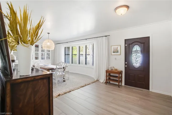 Entrance foyer with light wood finished floors and plenty of natural light