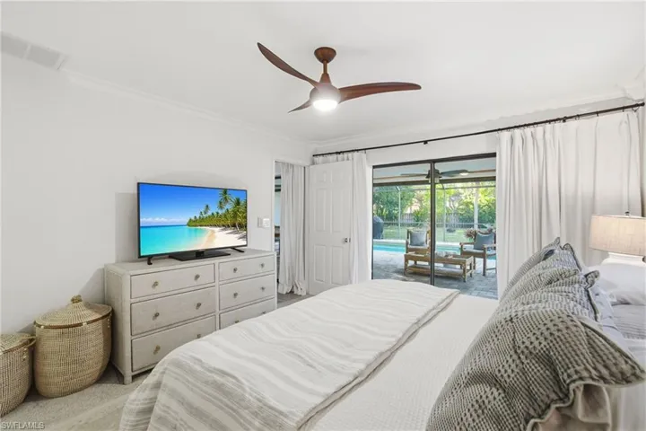 Bedroom with crown molding, ceiling fan, and access to outside