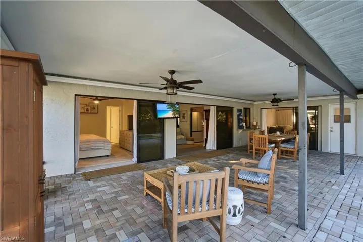 View of patio / terrace featuring outdoor dining area and ceiling fan