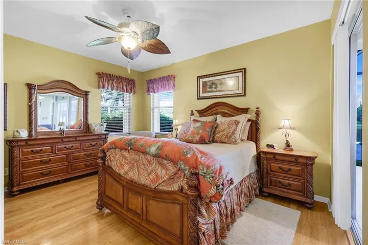 Bedroom with light wood finished floors and a ceiling fan