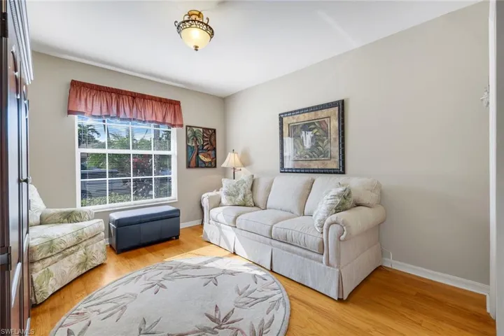 Living room with light wood finished floors and baseboards