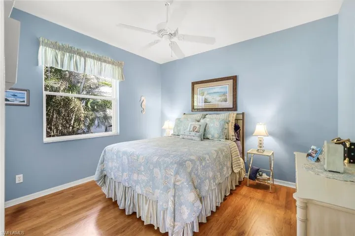 Bedroom featuring wood finished floors and a ceiling fan