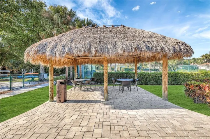 Surrounding community featuring a patio area and outdoor dining space