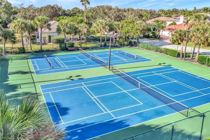 View of tennis court featuring community basketball court