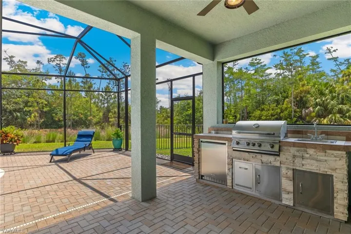 Of course it even has an outdoor kitchen, this home has it all