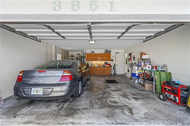 Deep garage with workshop.