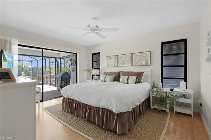 Sliders leading to pool from master bedroom.