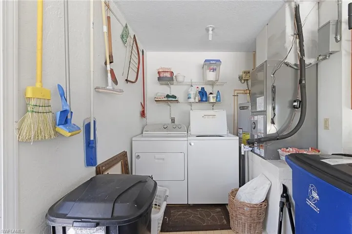 Laundry area is tucked in corner in the garage.