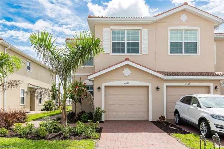 Mediterranean / spanish-style house with a garage