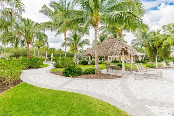 View of home's community featuring a patio area and a lawn