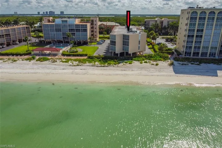 Bird's eye view featuring a beach view and a water view