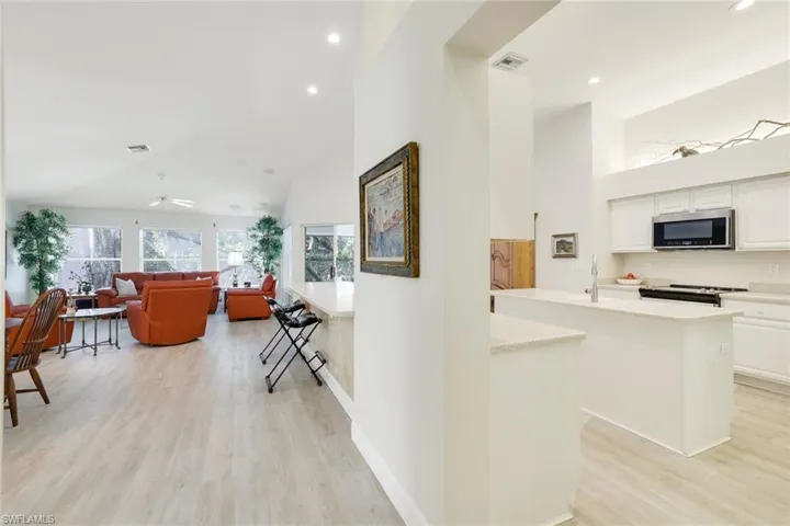Open kitchen and living area, with high ceilings, perfect for entertaining.