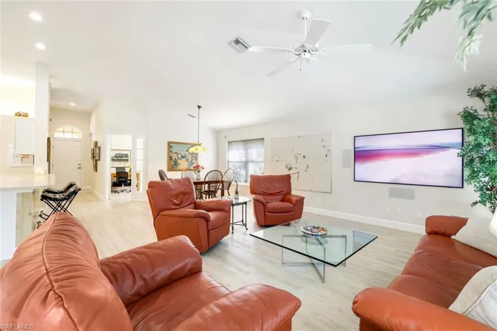 Ideal living area with large flat screen TV and surround sound.