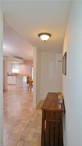 Corridor with light tile flooring