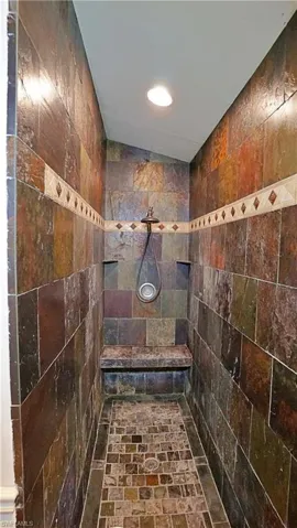 Bathroom featuring tiled shower