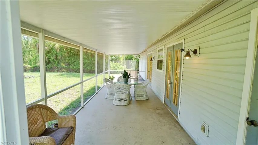 Unfurnished sunroom with a wealth of natural light