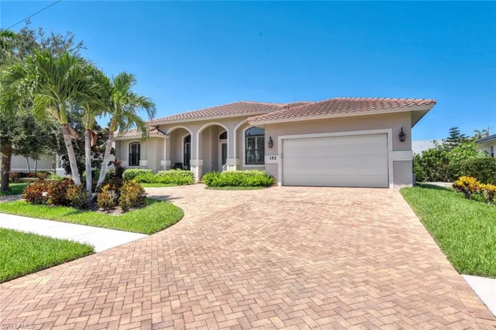 Mediterranean / spanish-style home featuring a garage