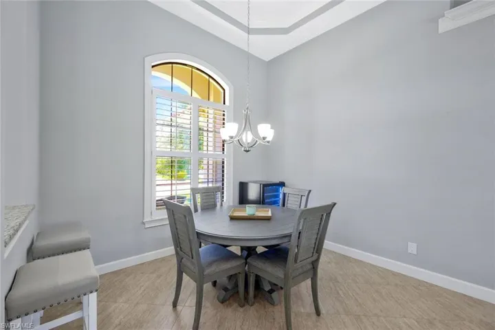 Dining room featuring ornamental molding and an inviting chandelier