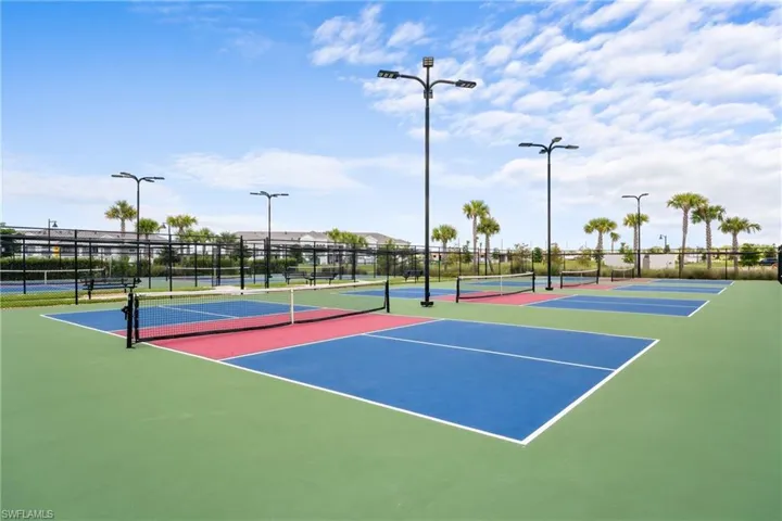View of tennis court featuring community basketball court