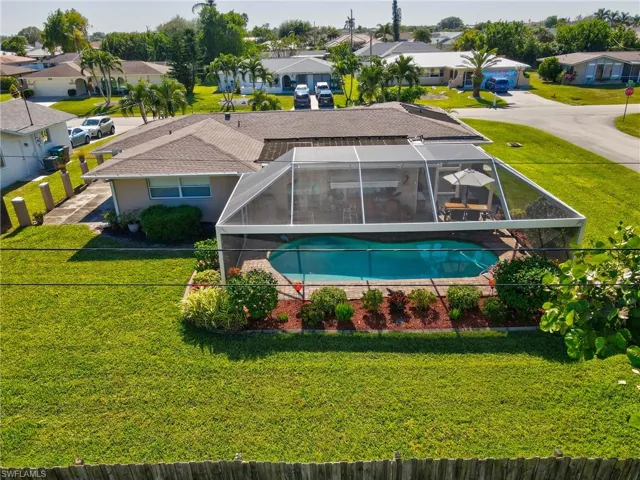 View of pool with a lanai