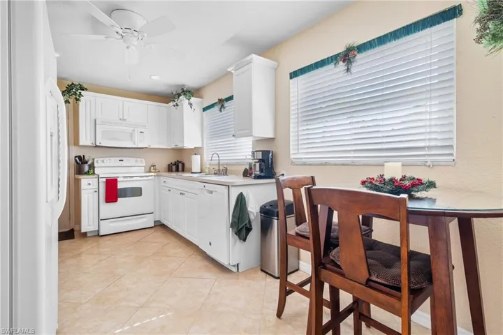 Kitchen with ceiling fan, and view of breakfast area