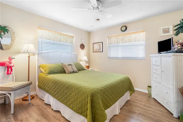 Guest Bedroom featuring light wood-type flooring and ceiling fan