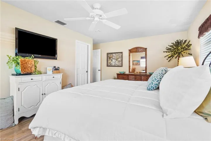 Bedroom with light wood-type flooring and ceiling fan