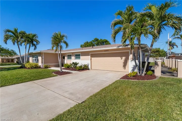 Single story home featuring concrete side area