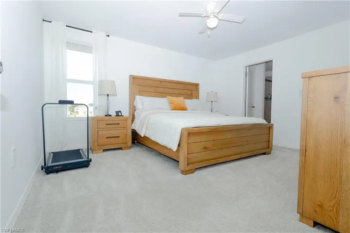 Bedroom featuring carpet floors and ceiling fan