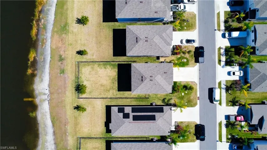 Aerial view of residential area with a large body of water