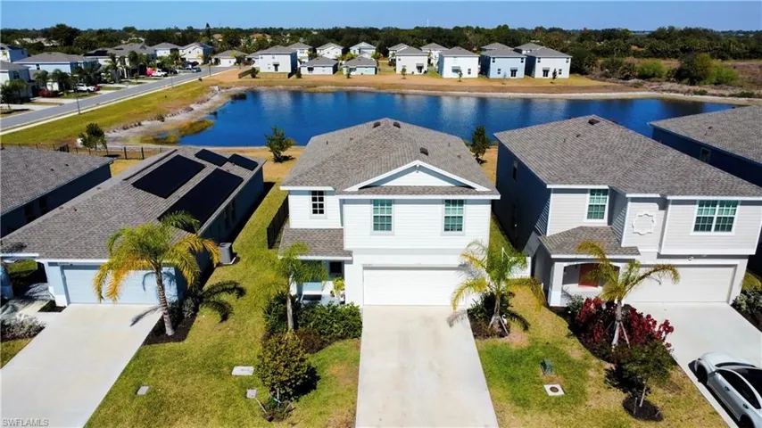 Aerial perspective of suburban area with a large body of water