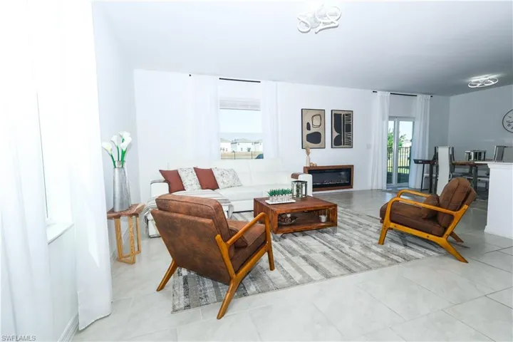 Living room featuring a glass covered fireplace