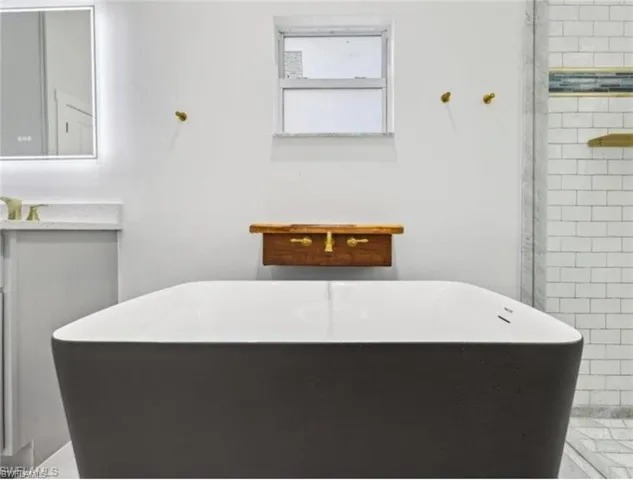 Full bath featuring a freestanding tub