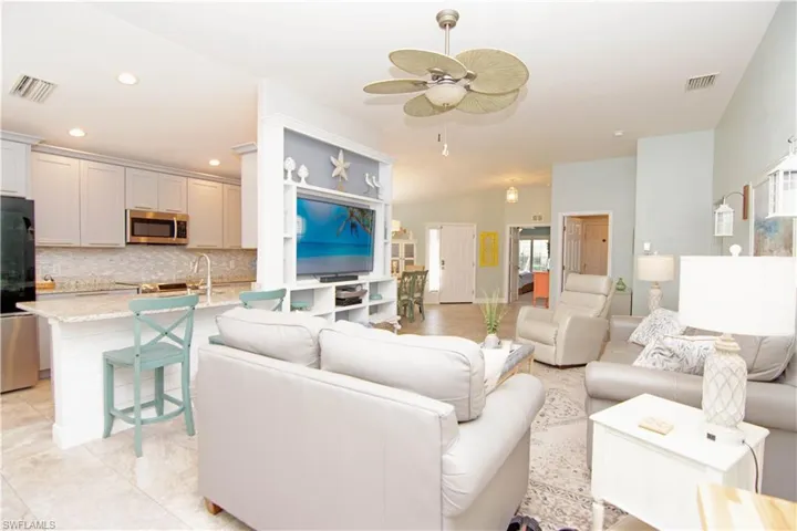 Light and bright, the space features tile flooring and sumptuous leather furnishings.