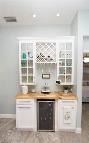 A built in bar with a Wine Refrigerator is a great addtion to the Living Room.