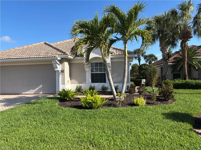 Beautiful landscaping awaits as you arrive at the property.