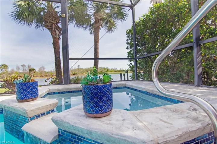 Pool and spa fully renovated with cobalt blue glass tile accents.