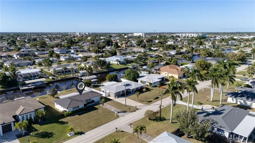 Aerial view of residential area with a nearby body of water